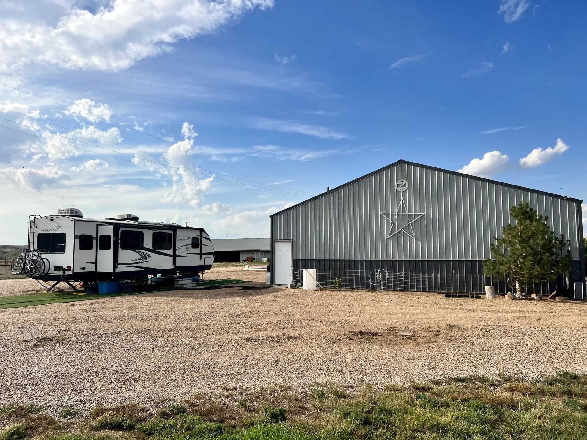 A couple of trailers parked in front of a building.