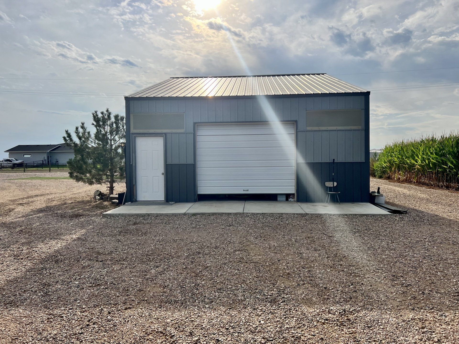 A garage with a white garage door and a white door