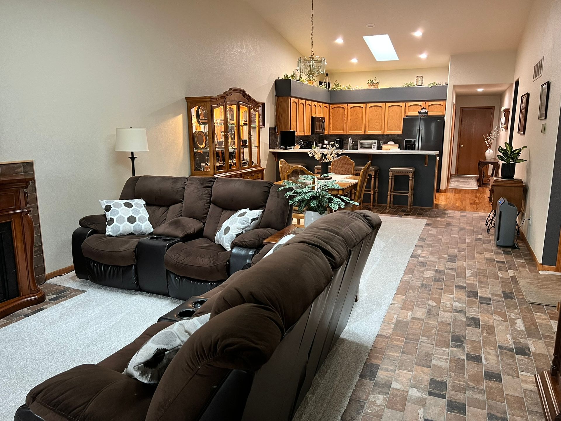 A living room filled with furniture and a fireplace.