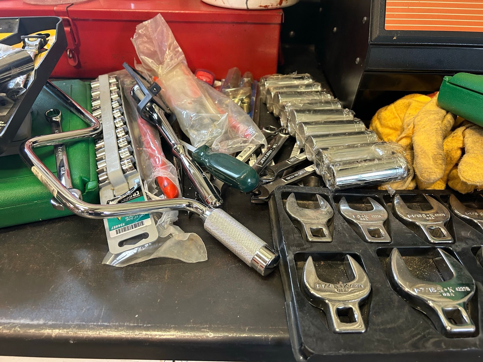 A bunch of tools are sitting on a table.