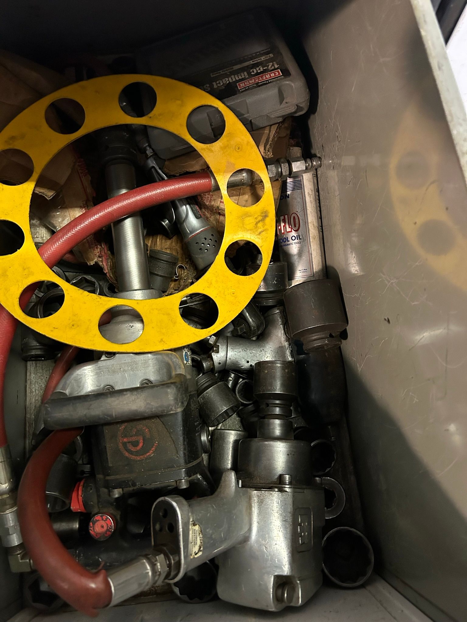 A close up of a machine with a yellow ring on top of it.