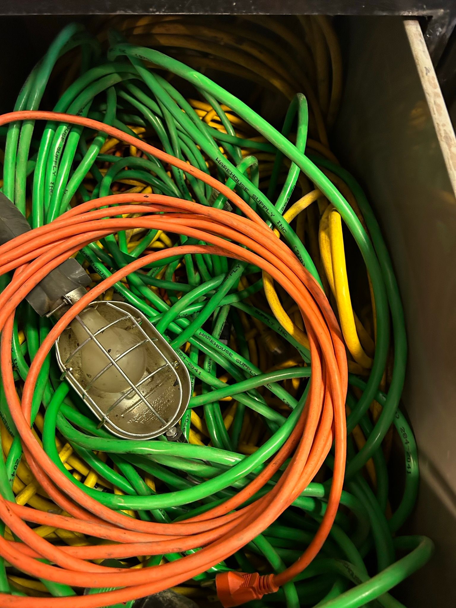 A bunch of electrical wires are in a box