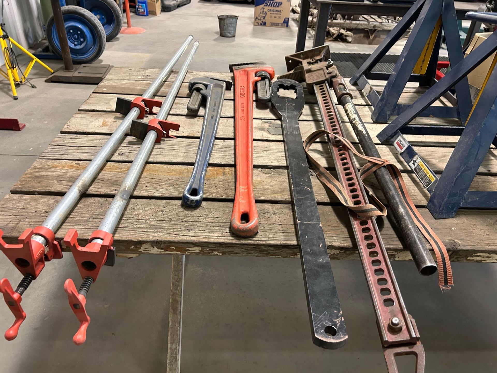 A wooden table with a bunch of tools on it