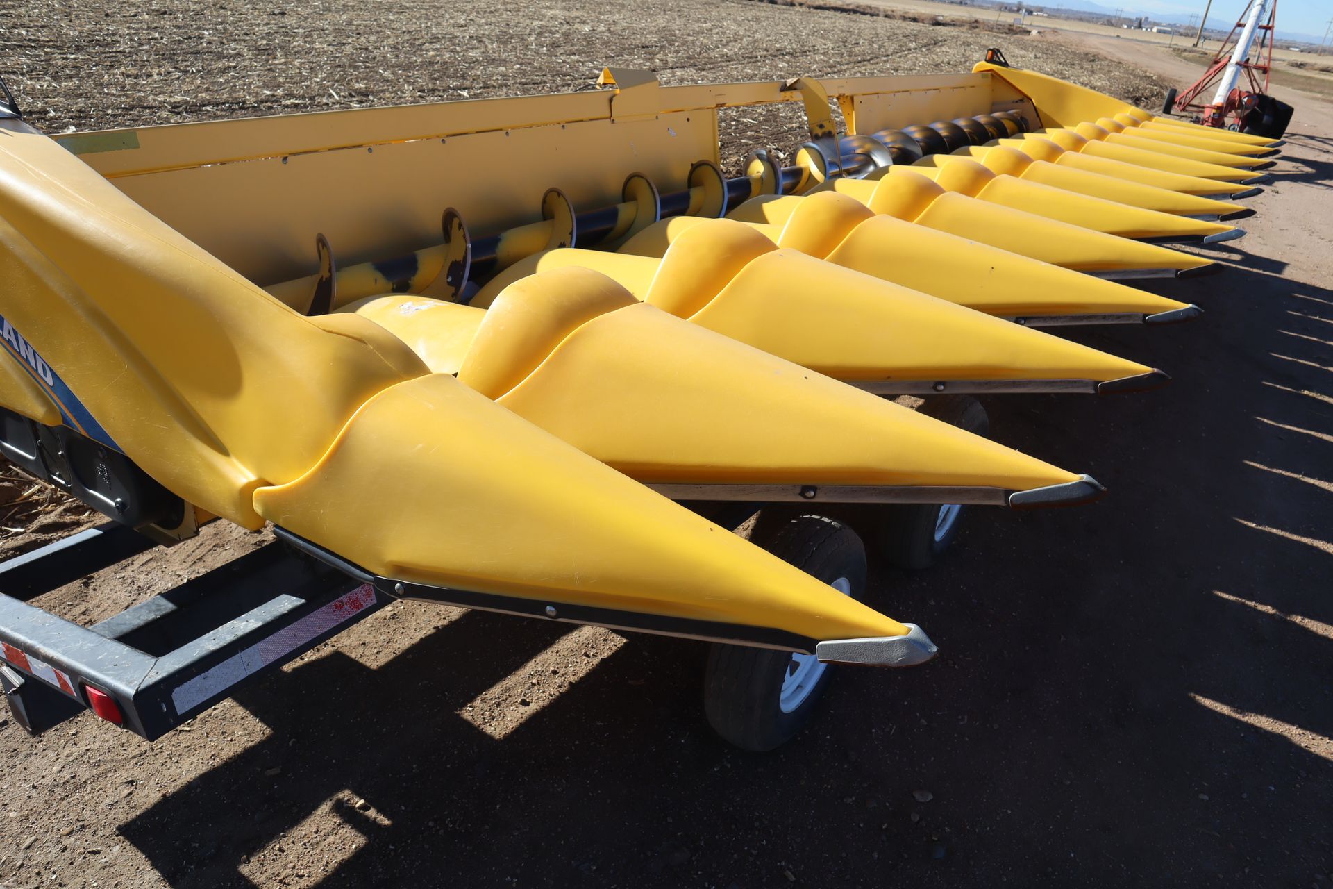 A bunch of yellow cones are sitting on the ground