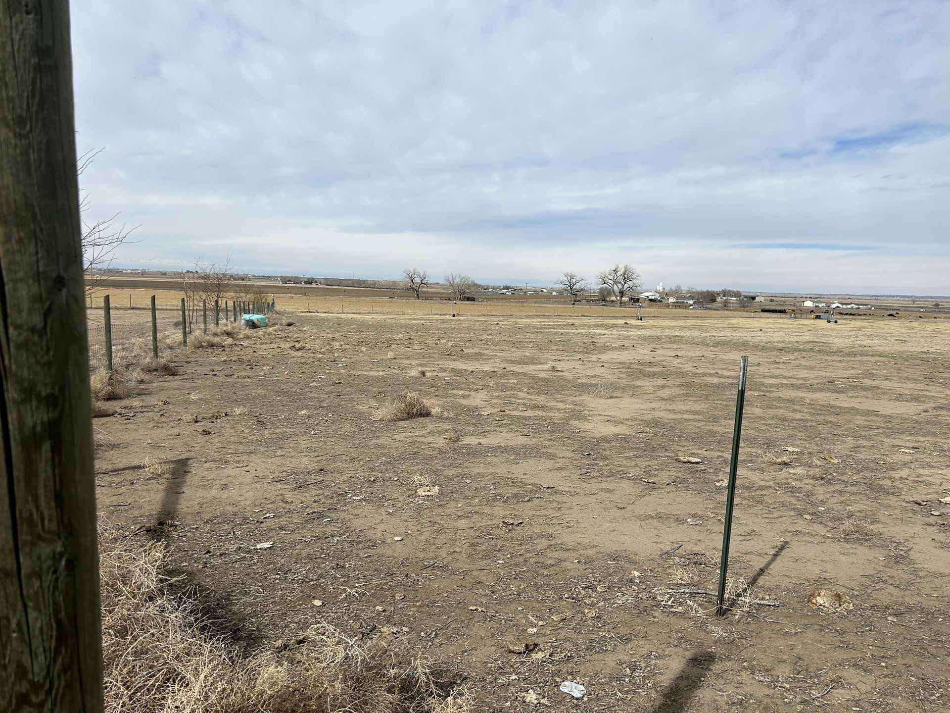 There is a fence in the middle of the field.