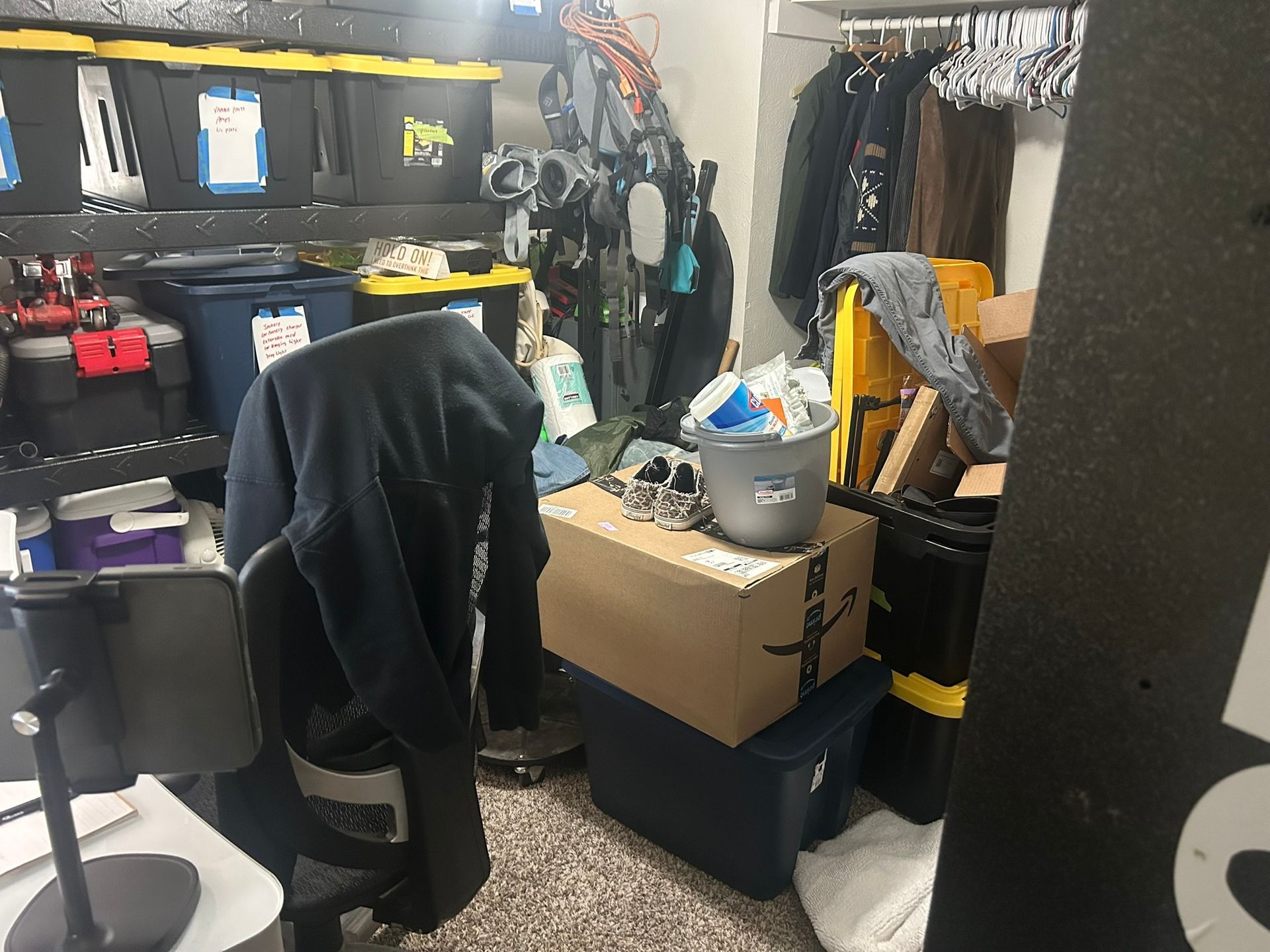 A room filled with lots of boxes and a chair.