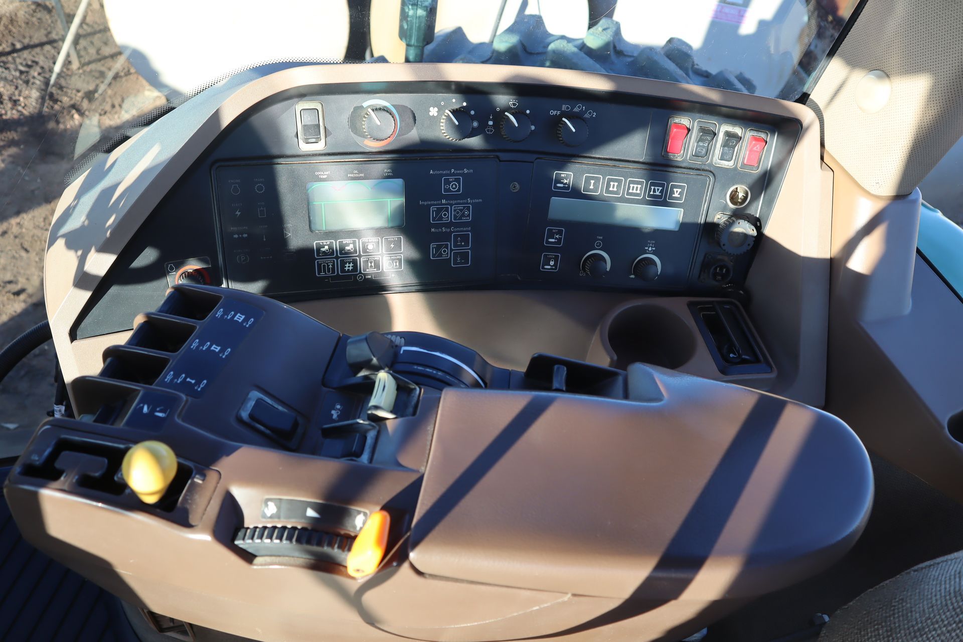 The dashboard of a john deere tractor is shown