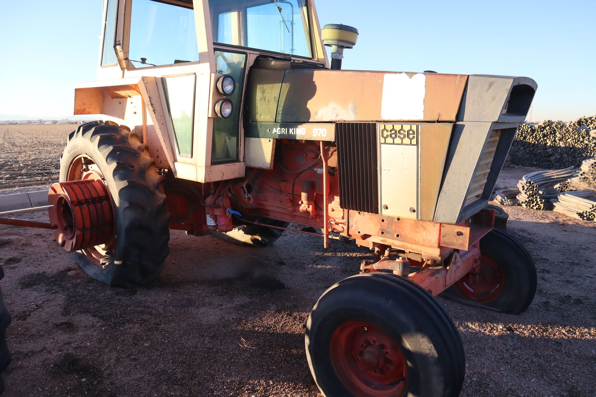 An old rusty tractor with the word case on it