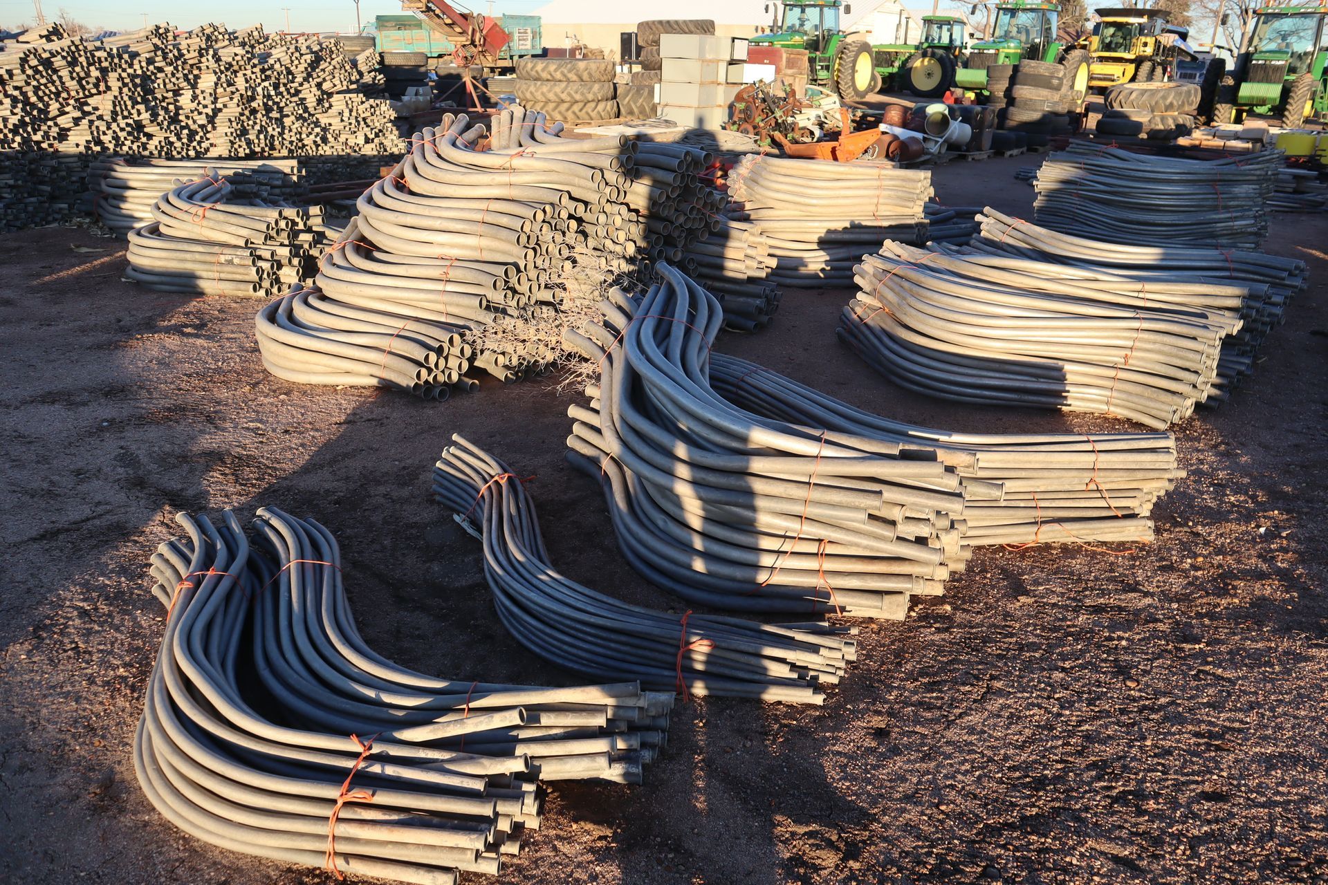 A bunch of metal pipes are stacked on top of each other