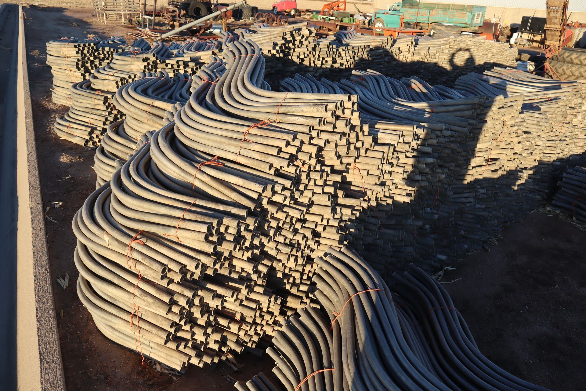 A bunch of pipes are stacked on top of each other