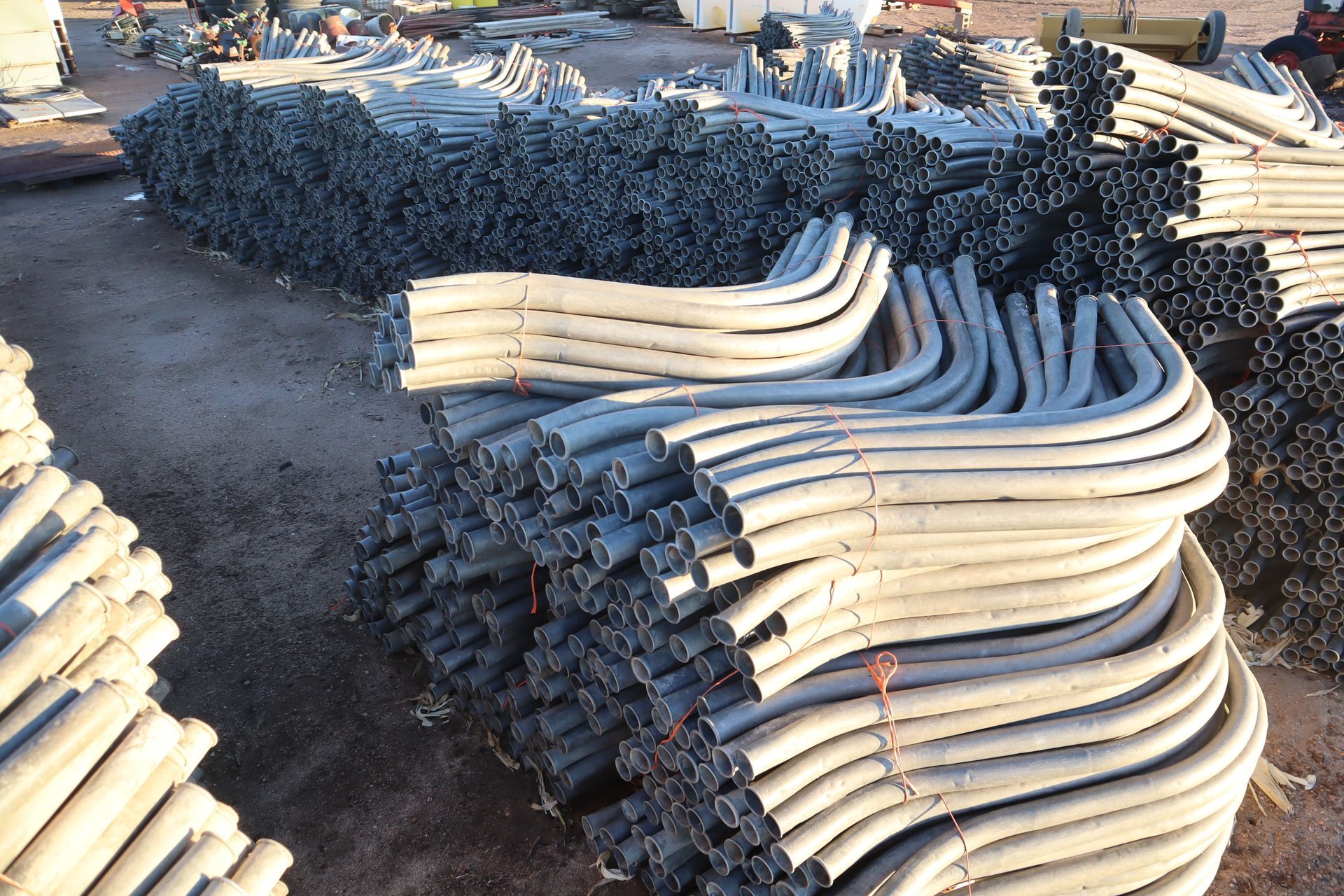 A bunch of pipes are stacked on top of each other