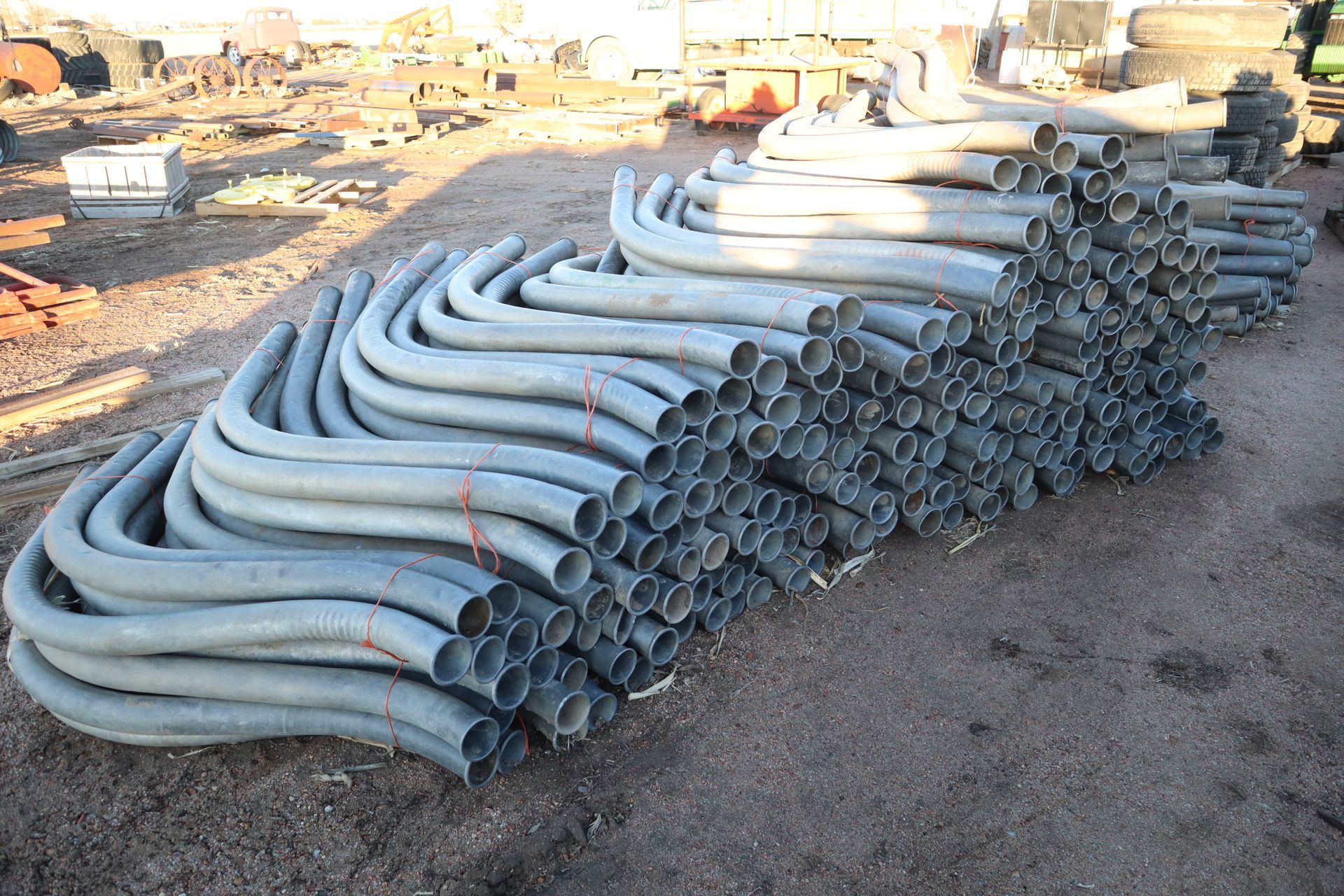 A bunch of metal pipes are stacked on top of each other