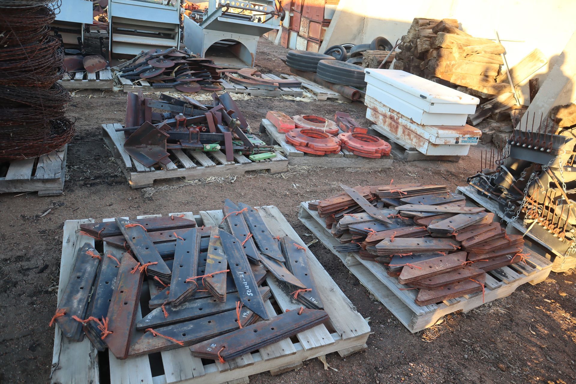 A bunch of wooden pallets are stacked on top of each other