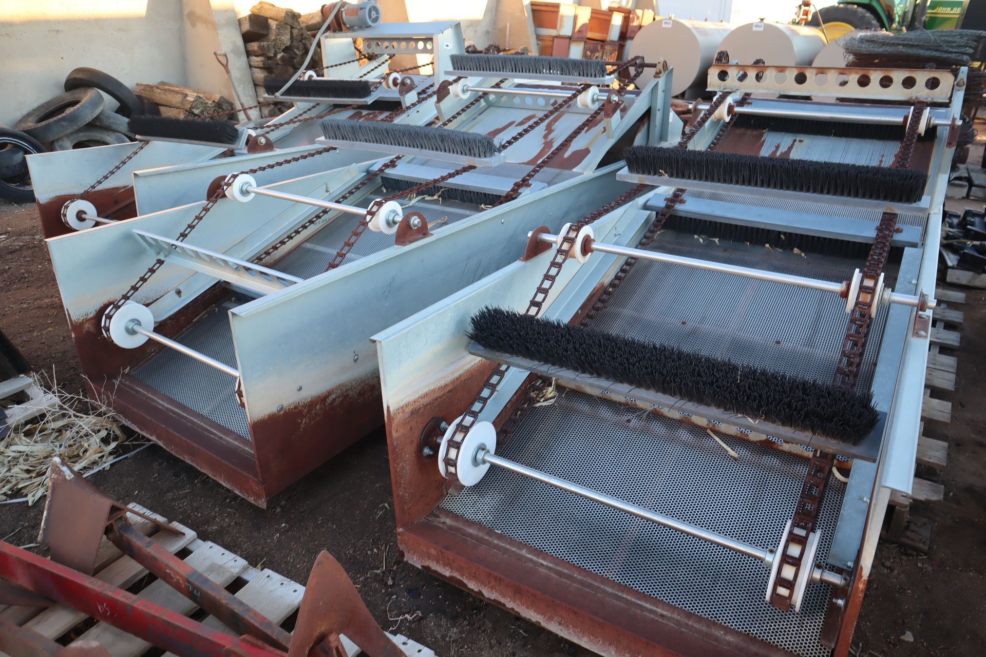 A bunch of metal pieces are sitting on the ground