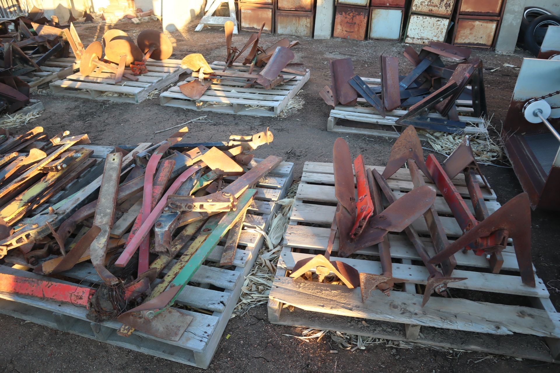 A bunch of wooden pallets are stacked on top of each other