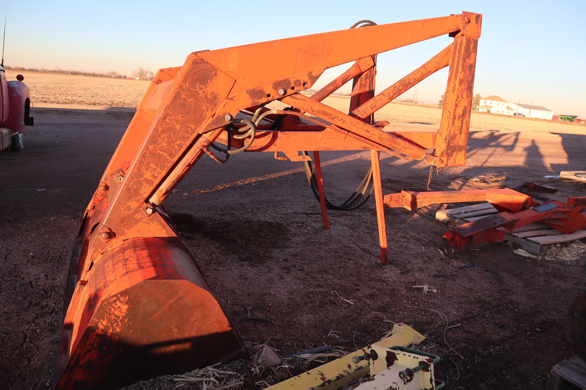 A rusty piece of equipment is sitting on the ground