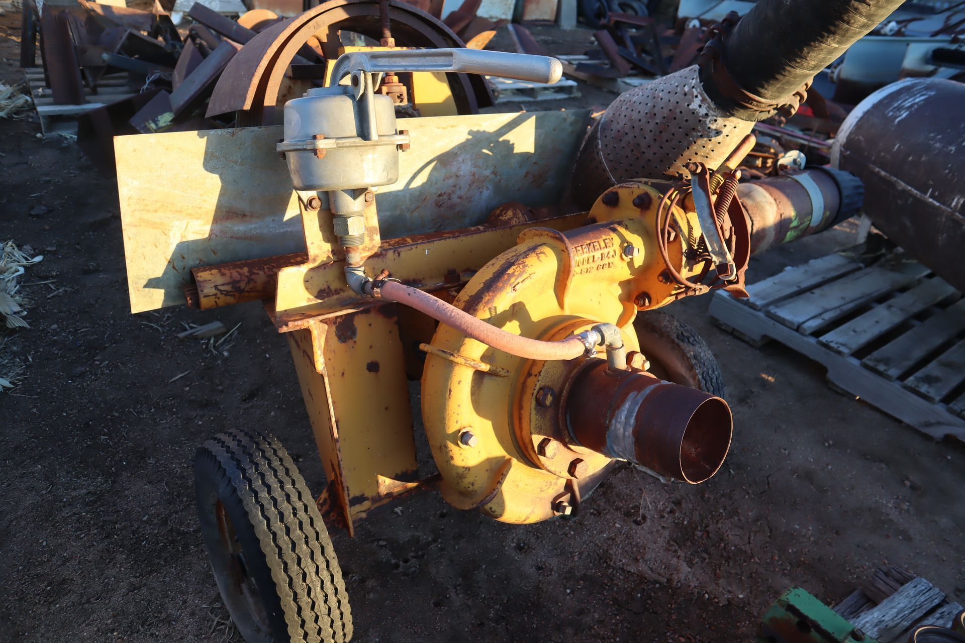 A yellow machine with a hose attached to it