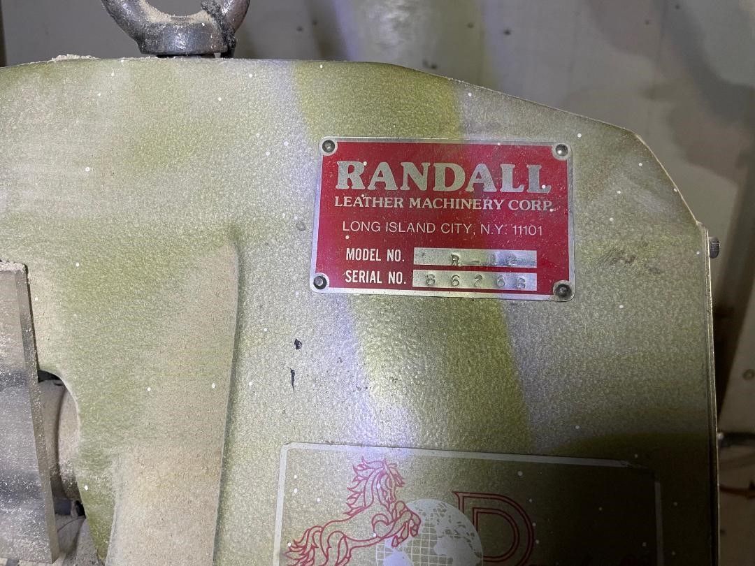 Red metal plate on a green machine, 