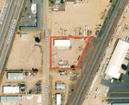 An aerial view of a building with a red outline around it