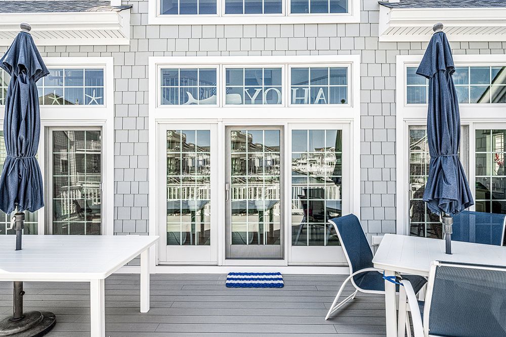 a patio with tables and chairs