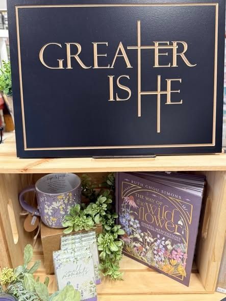 A shelf display featuring a sign that says