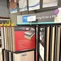Display of flooring samples in a store with signage for 
