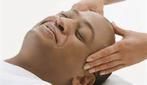 A man is getting a head massage at a spa.