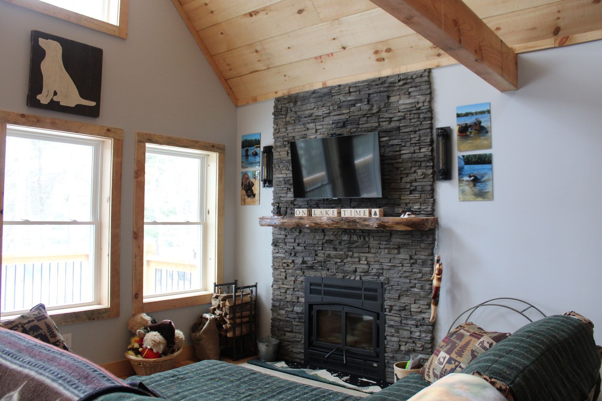 A living room with a fireplace and a flat screen tv