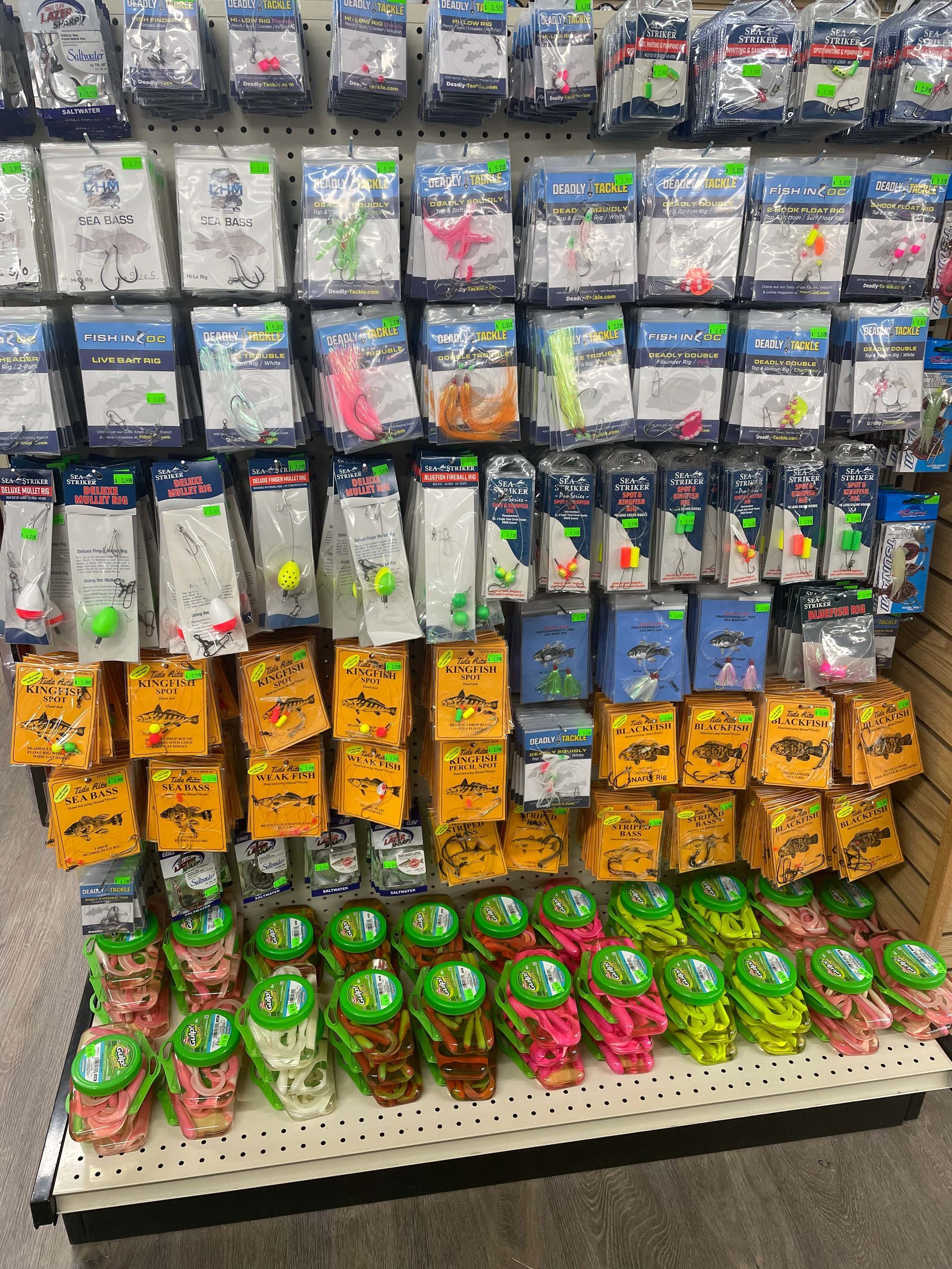 There are many different types of fishing lures on display in this store.