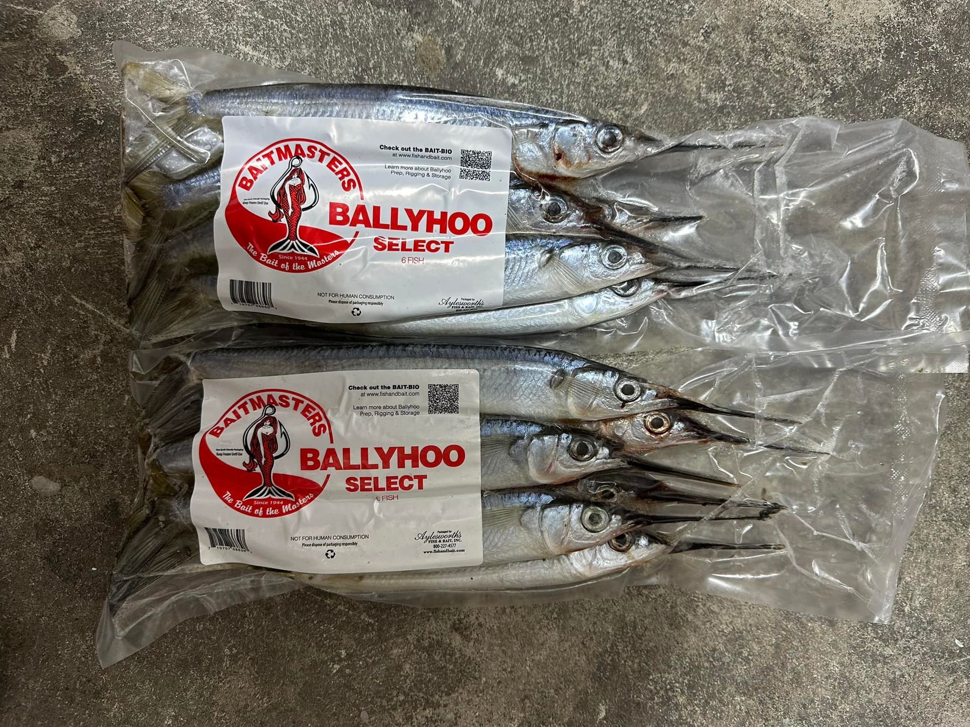 Two bags of fish with labels that say ballyhoo select.