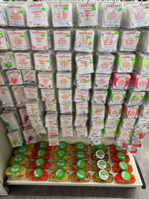 A store shelf filled with lots of different types of candy.