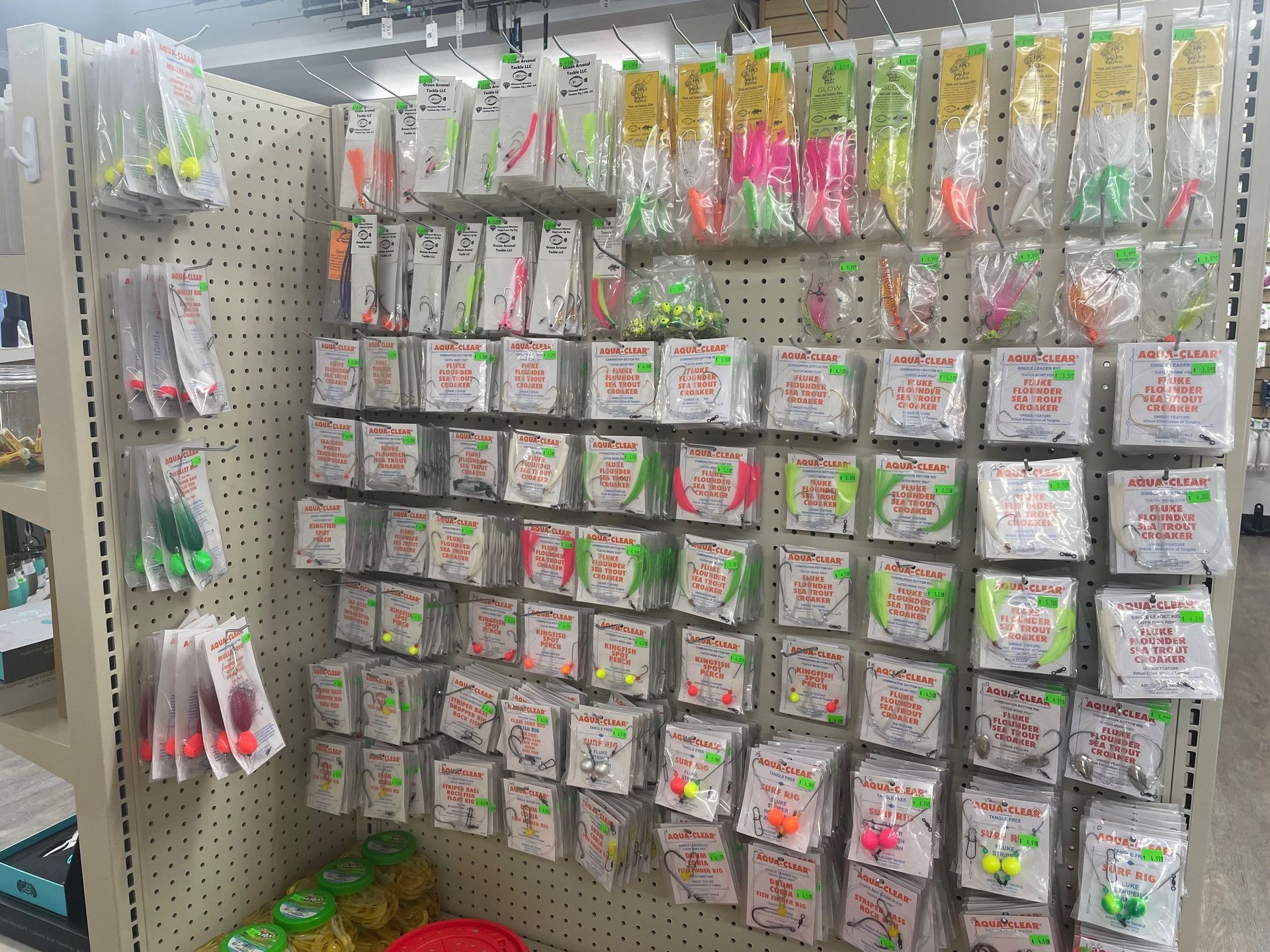 A display of fishing lures and hooks in a store.