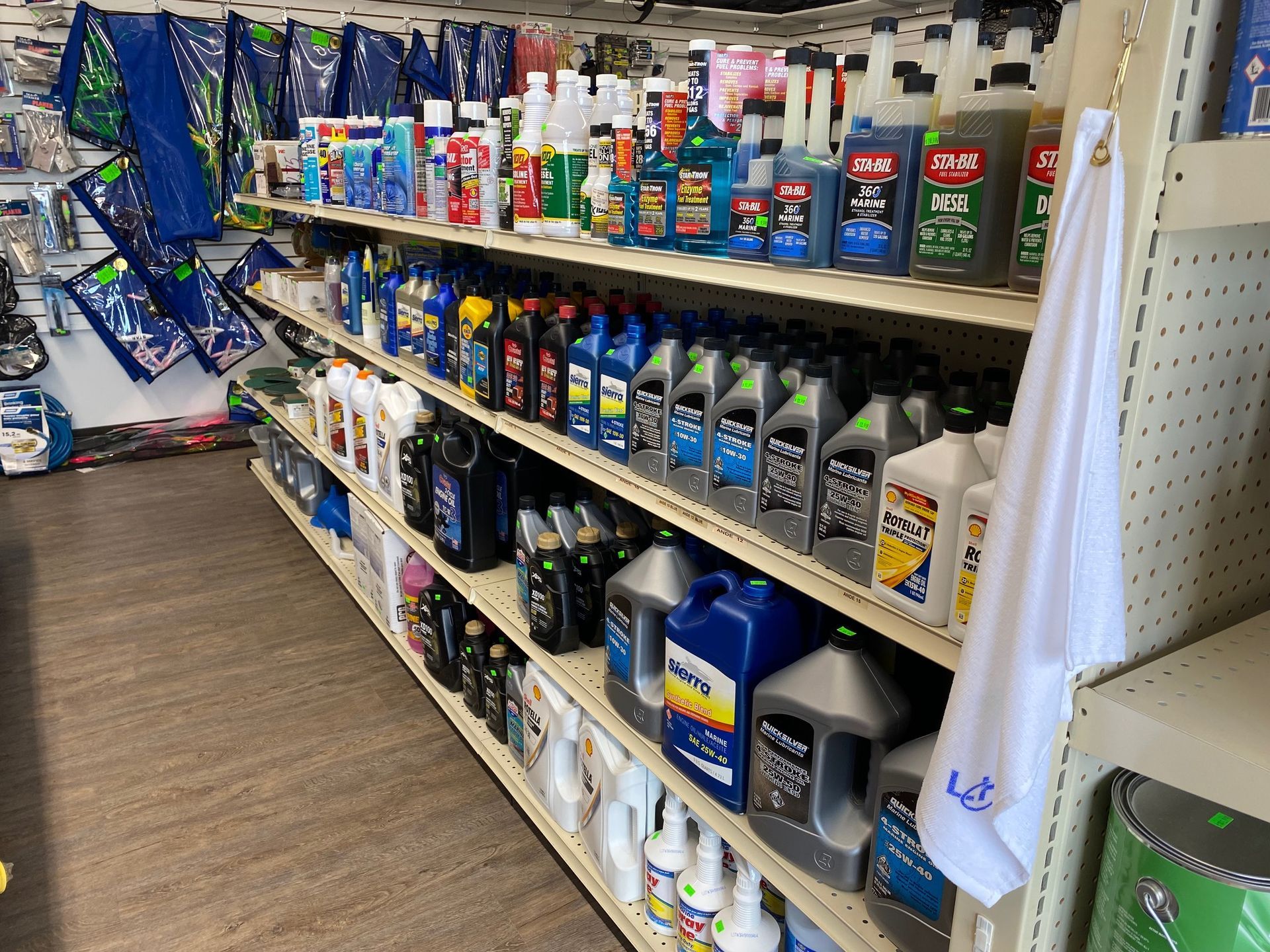 A store aisle filled with lots of bottles of oil.