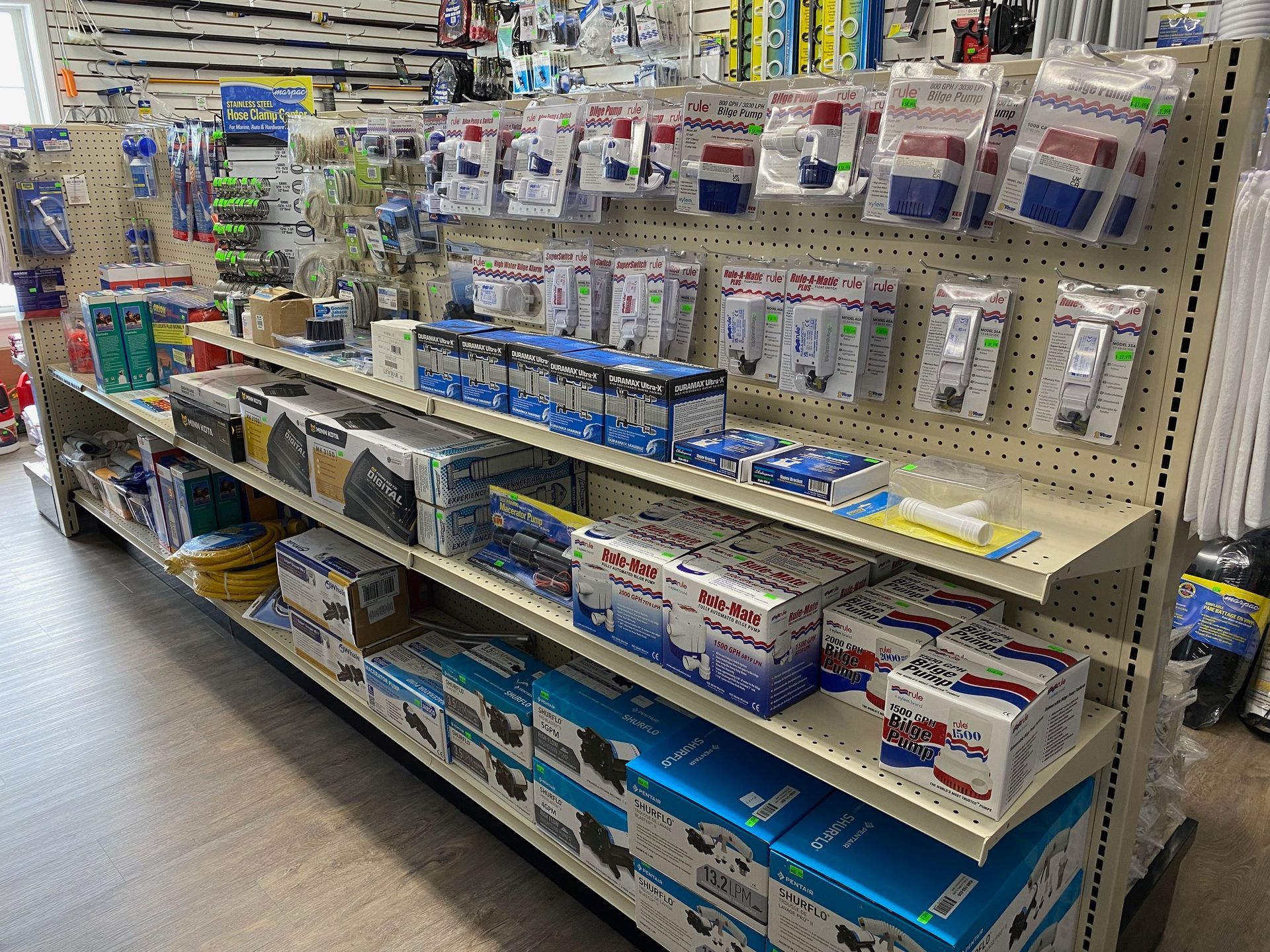 A store shelf filled with lots of different items.