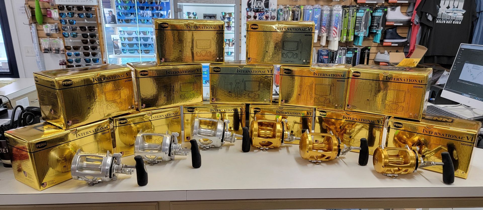 A bunch of gold boxes are sitting on top of a table.