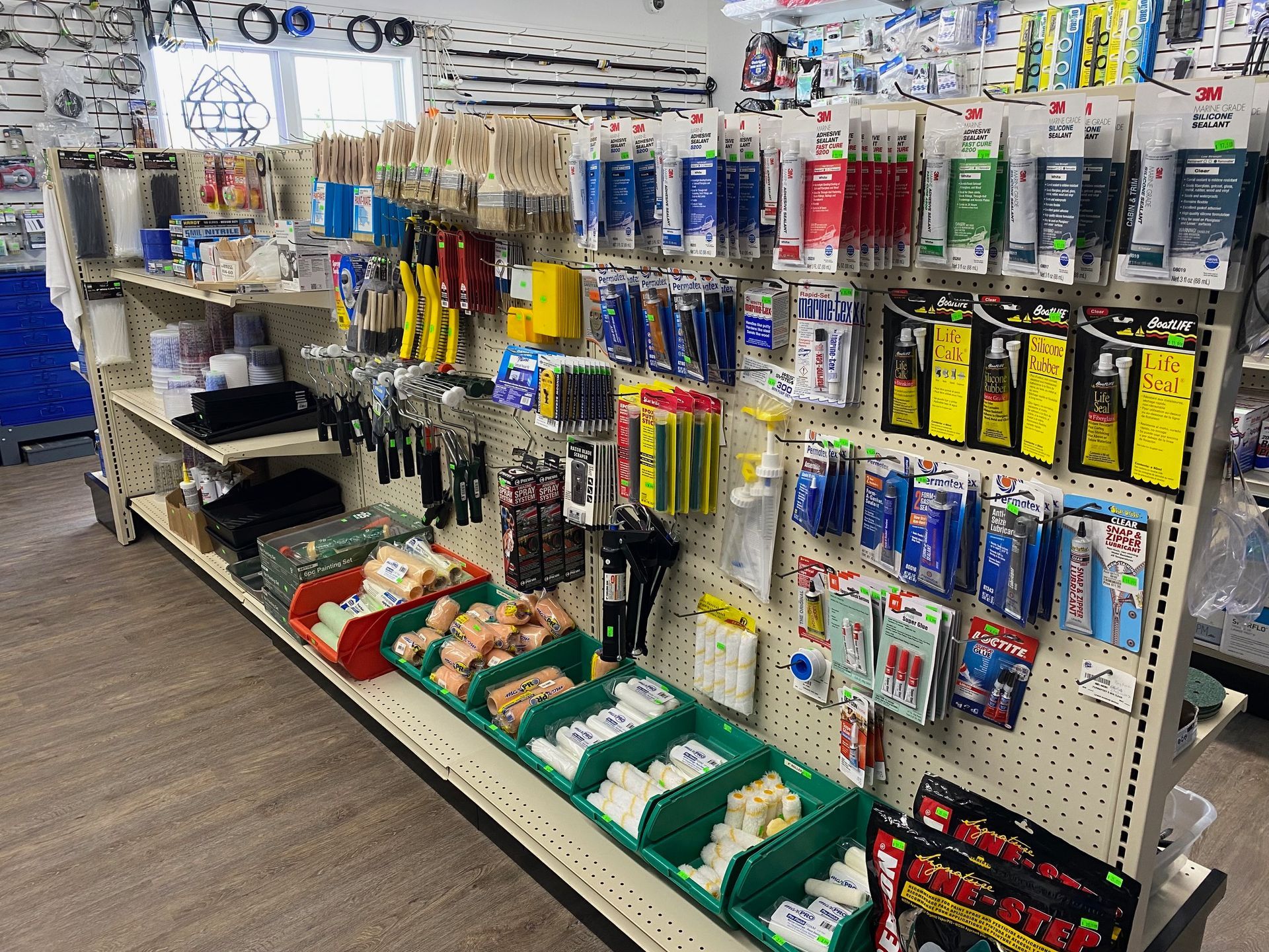 A store shelf filled with lots of tools and supplies.