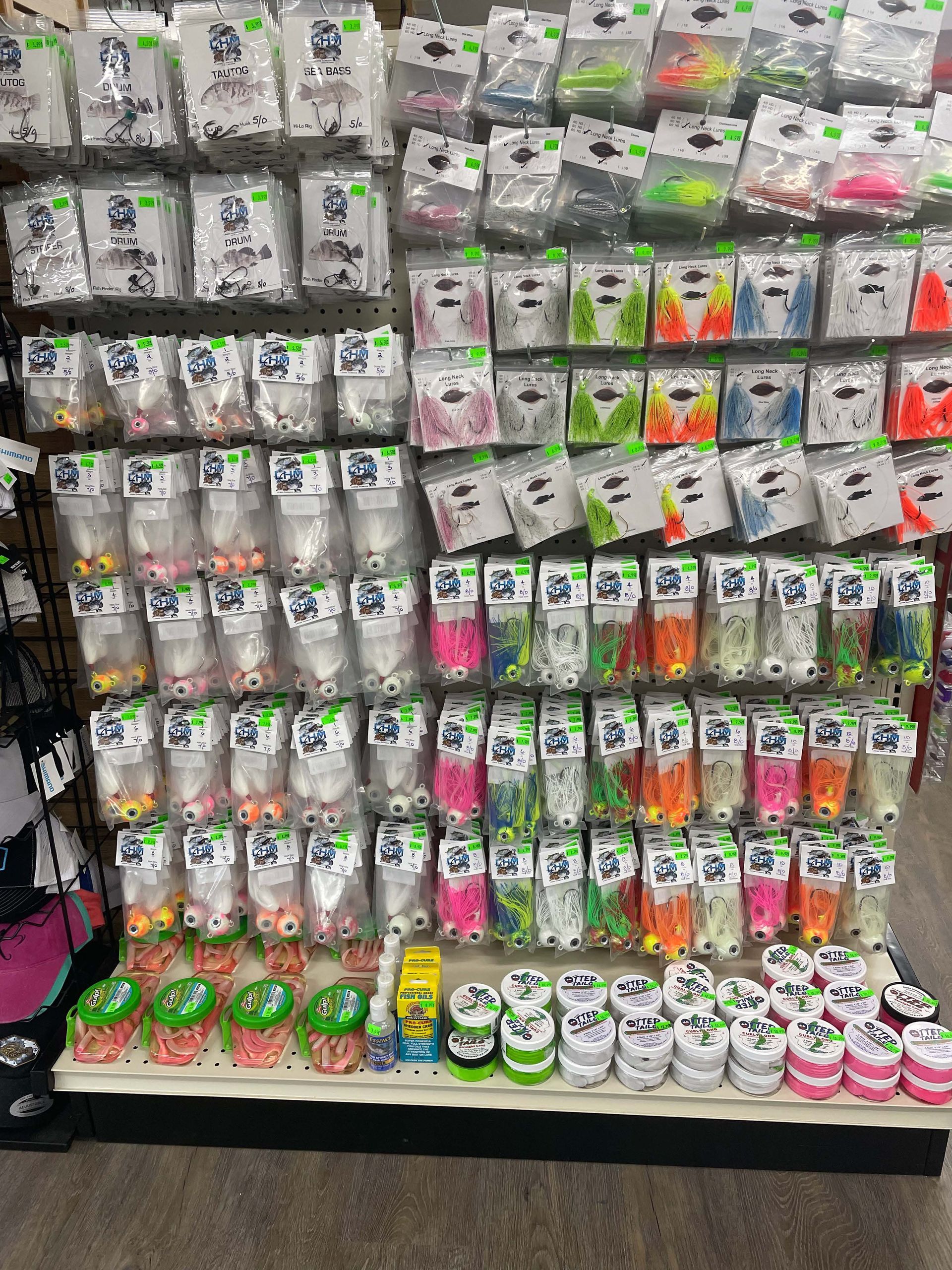 There are many different types of fishing lures on display in this store.