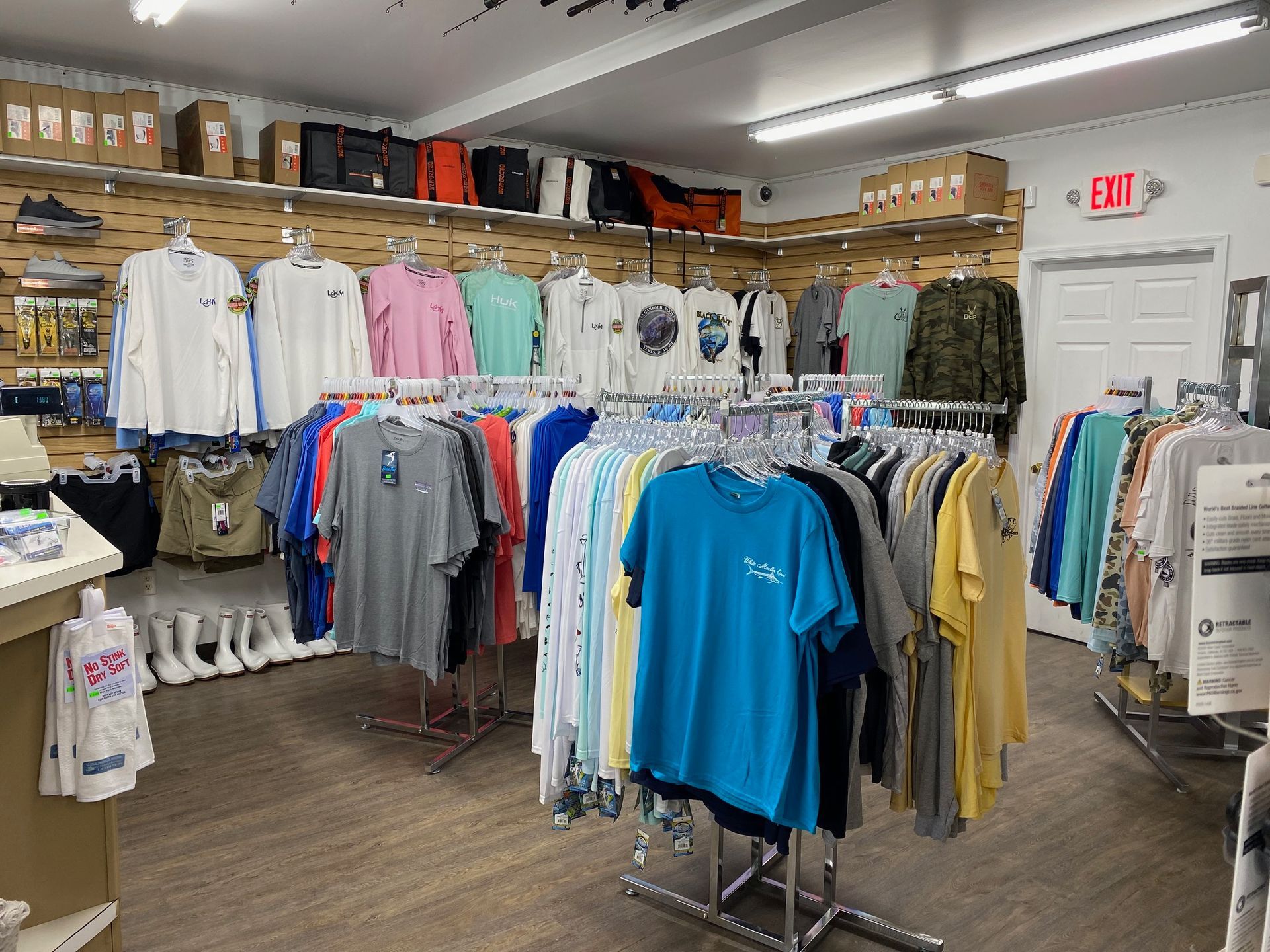 A store filled with lots of clothes hanging on racks.