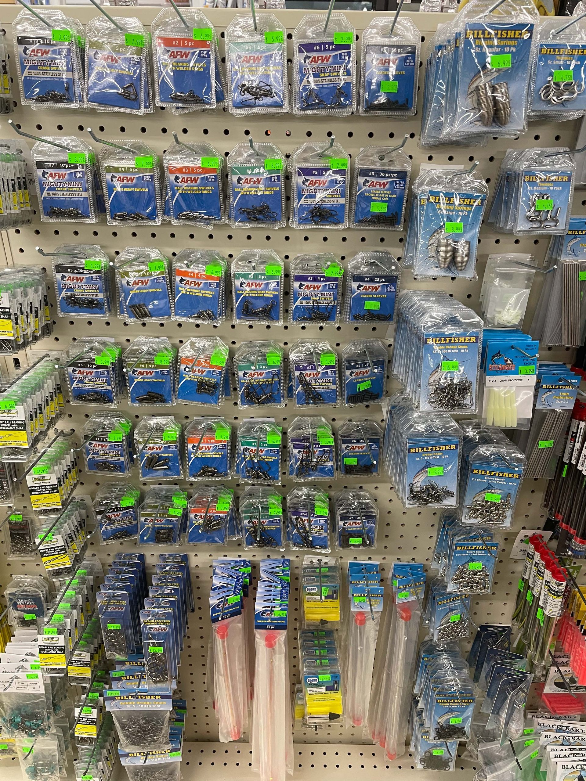 There are many different types of fishing lures on display in this store.