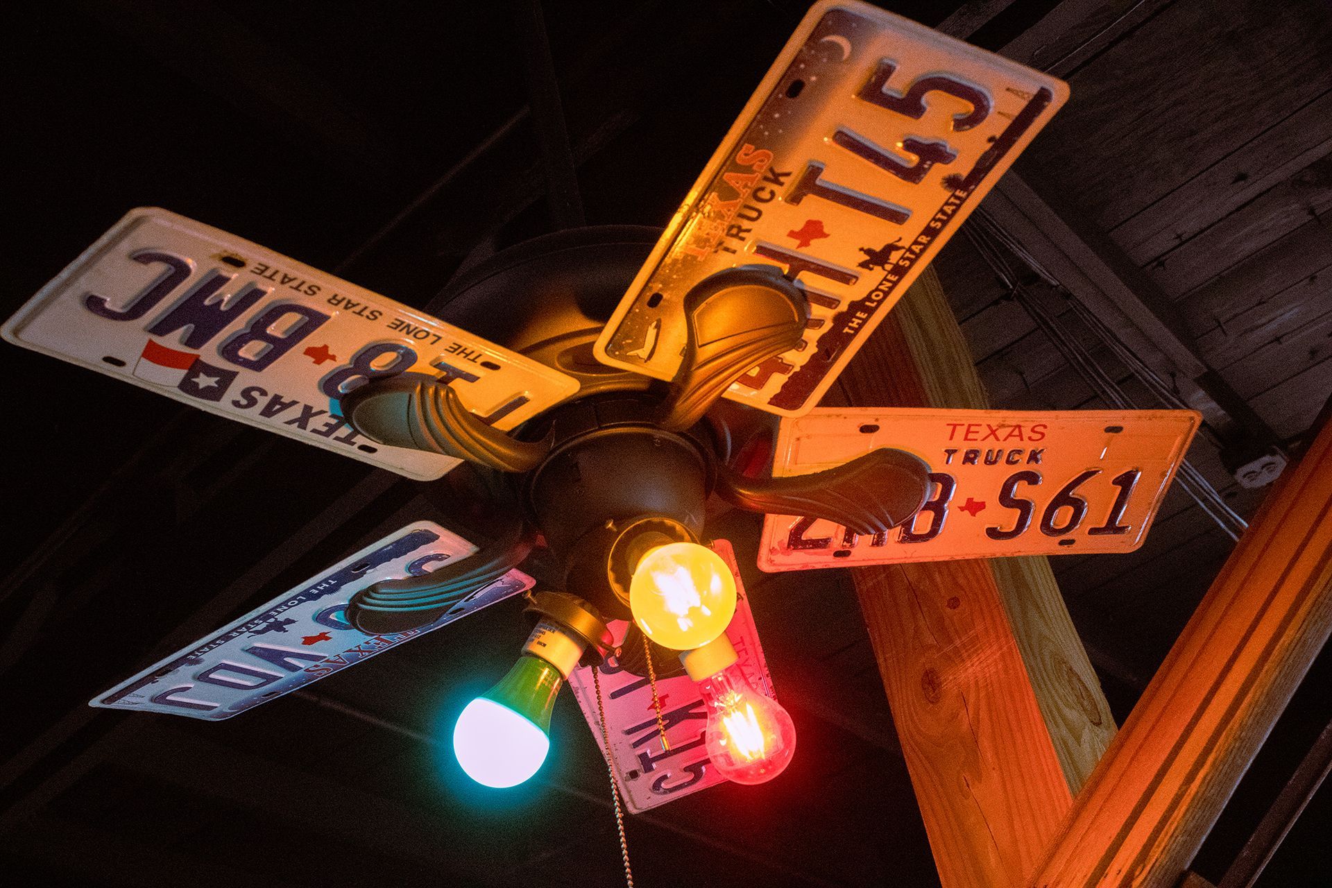 A ceiling fan with texas license plates on it