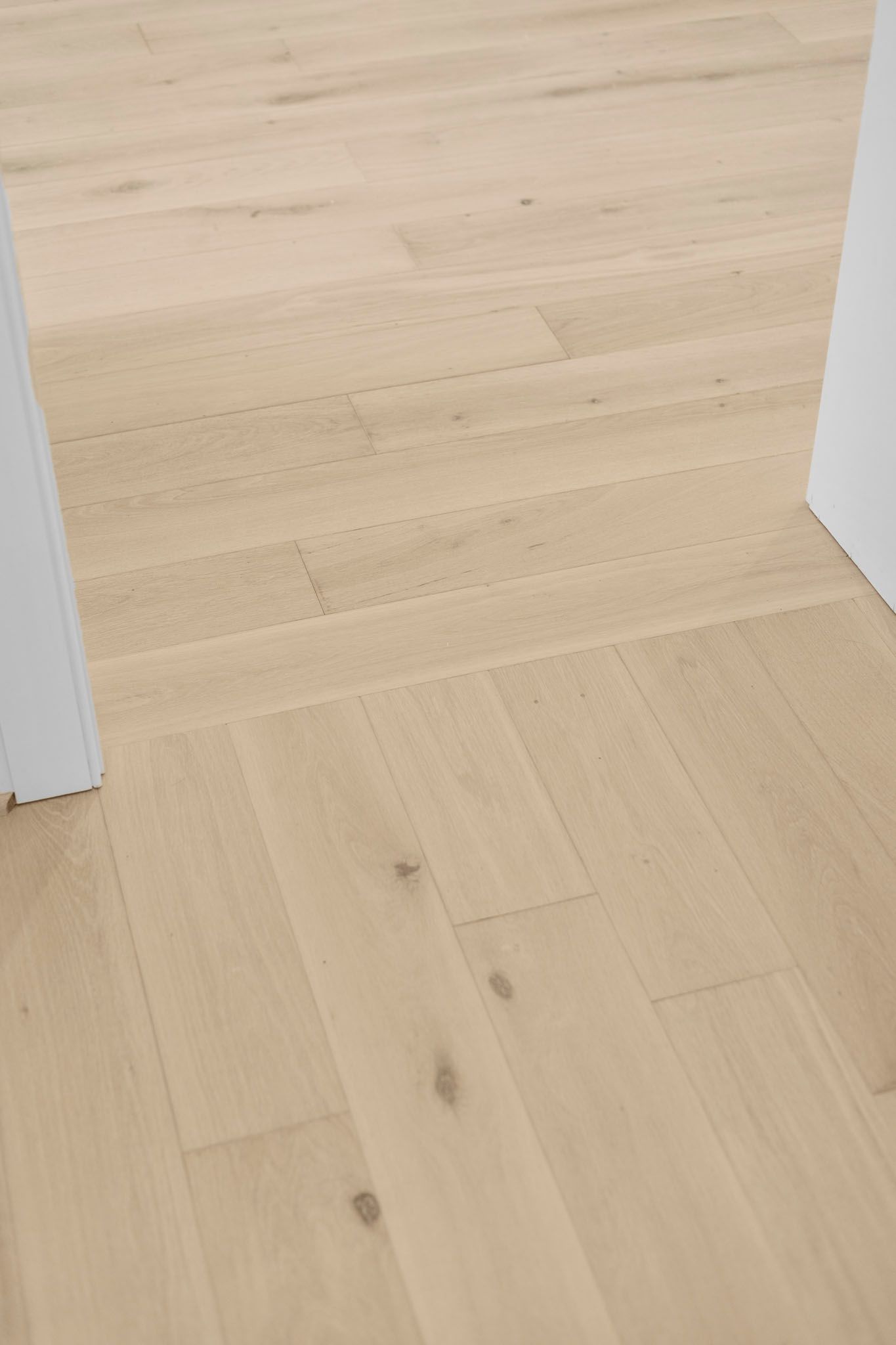 Light wood floor in a doorway, viewed from above