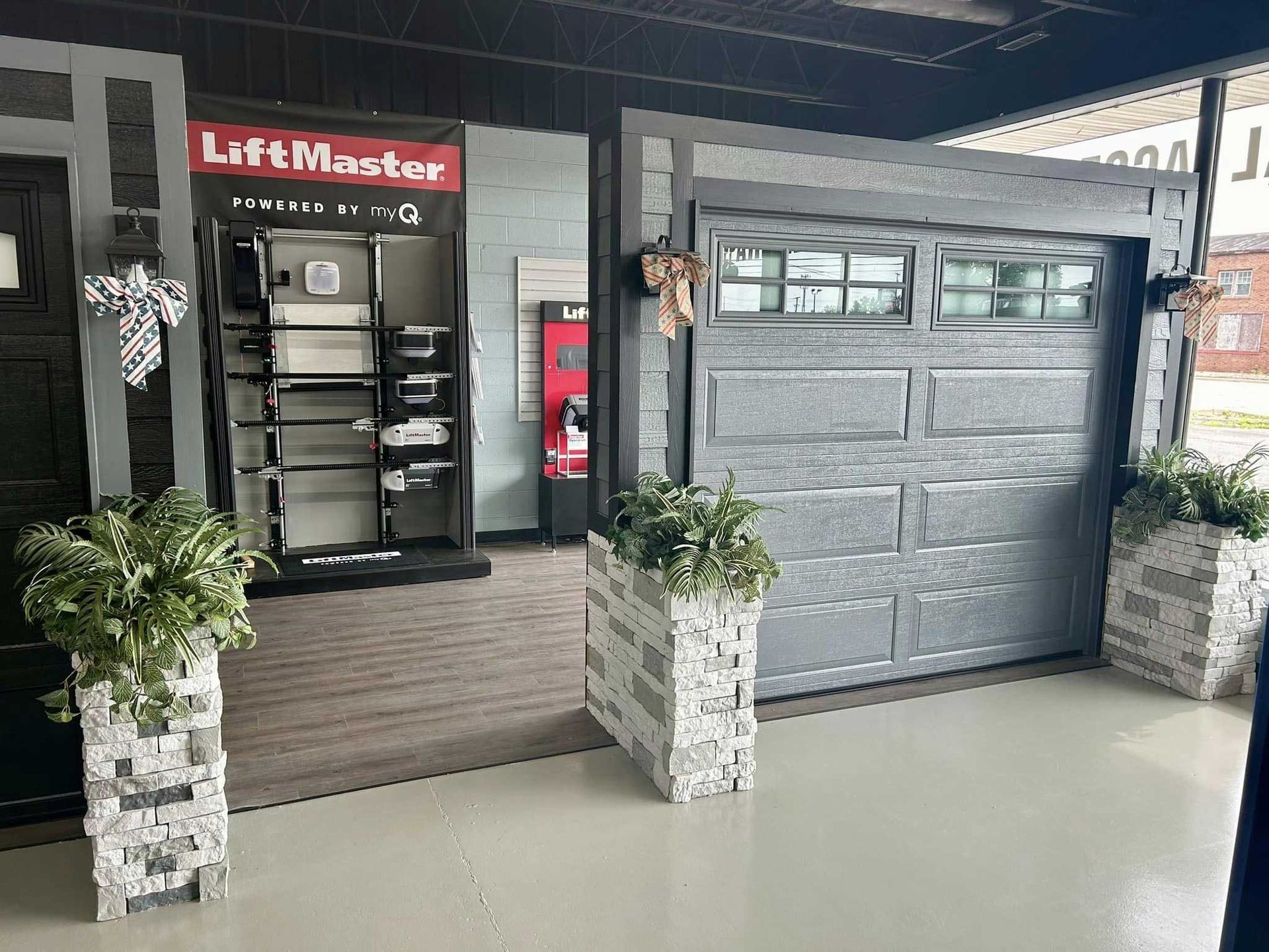 Garage door showroom with display doors and accessories, showcasing installation options and features.