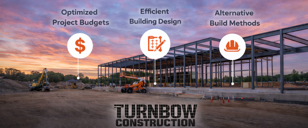 Steel frame of a building under construction, brown beams against a blue sky.