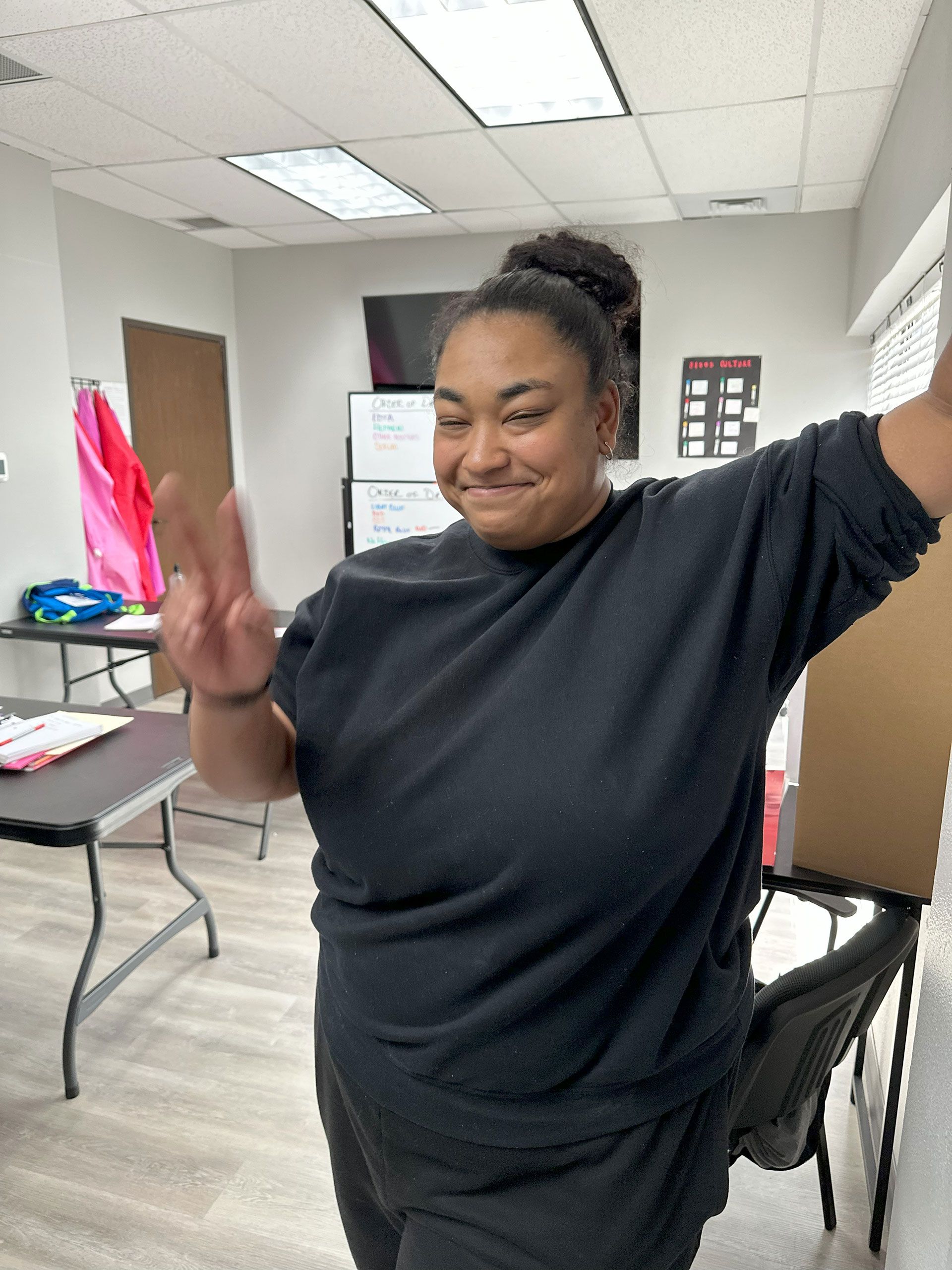 A woman in peace sign