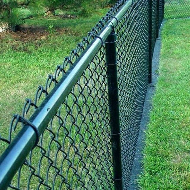 Black chain-link fence with a black top rail and posts on a grassy lawn.