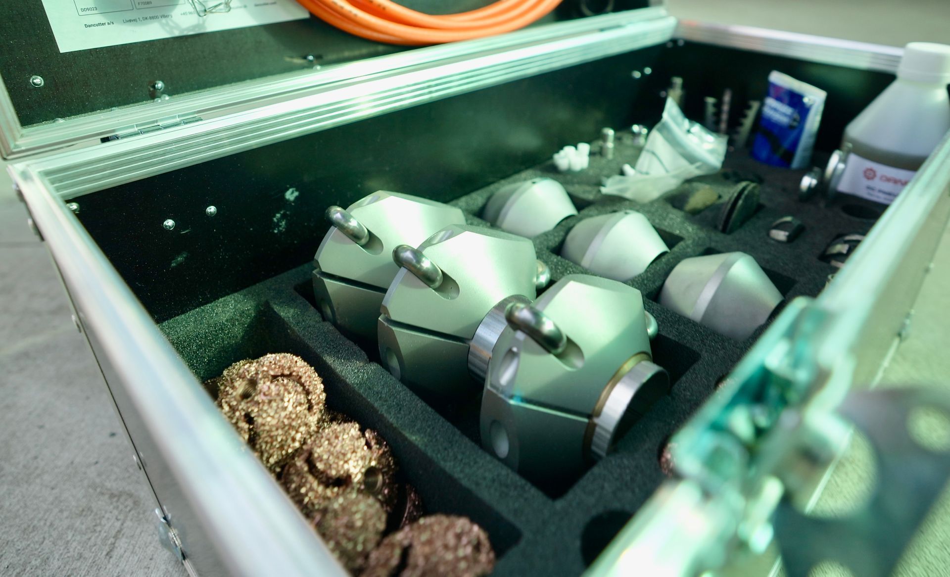 A metal case filled with a bunch of metal objects.