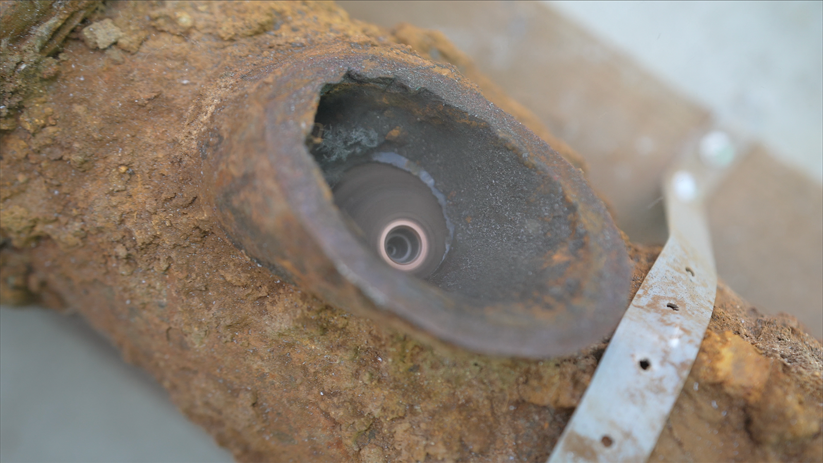 A close up of a piece of wood with a hole in it.