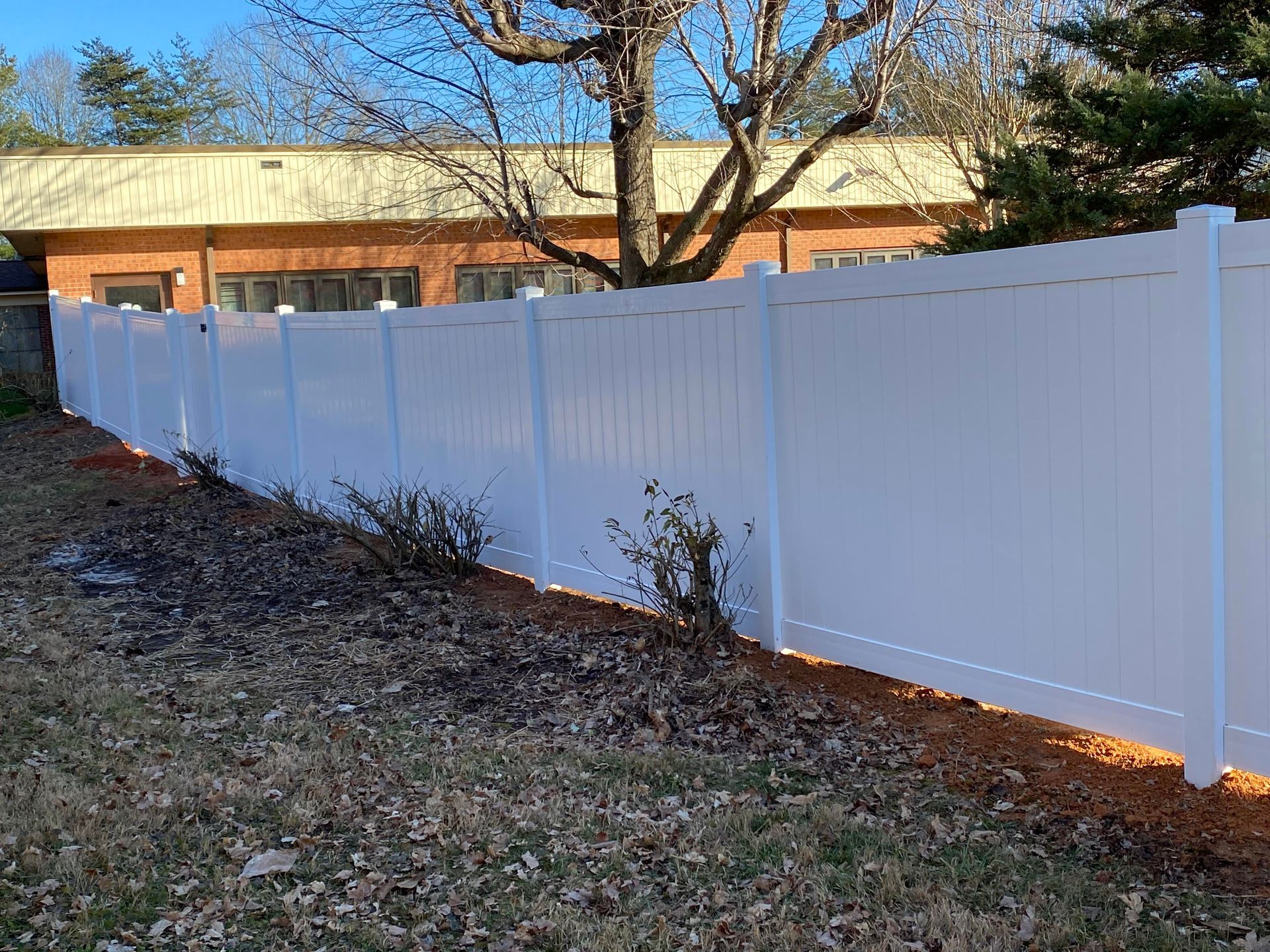 White vinyl privacy fence installation service