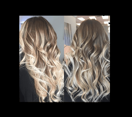 A woman with long blonde hair is standing in front of a mirror.