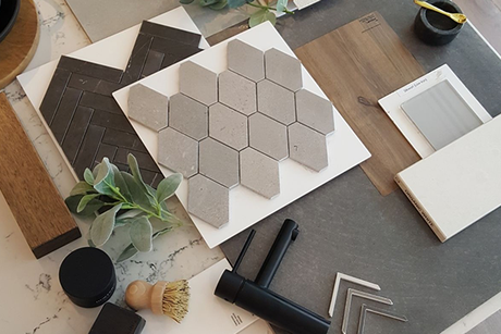 A table topped with a variety of tiles and wood samples.